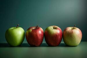 Four Apples of Different Colors Lined Up photo