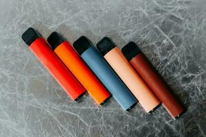 Multicolored multi-use electronic vape cigarettes photo