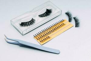 Artificial false fluffy eyelashes with tweezers photo