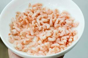 Close-up of peeled and shelled boiled shrimp photo