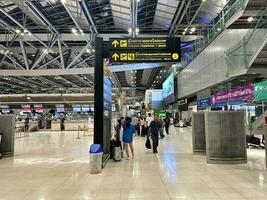 Passengers rush around the airline's check-in area in Suvarnabhumi Airport, Bangkok, on July 10, 2023. photo