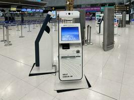 Night view, 15 July 2023, of a Bangkok departure kiosk at Suvarnabhumi Airport terminal. photo