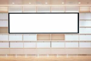 Blank white screen on shelf in modern office. Mock up photo