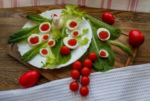 background of red caviar on dsrk wooden surface. tartlets with red caviar photo