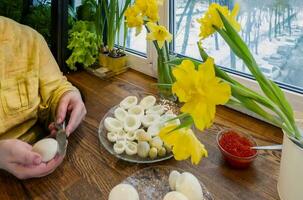 Step by step. egg cut in half, for making stuffed eggs photo