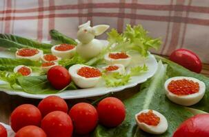 background of red caviar on dsrk wooden surface. tartlets with red caviar photo