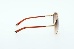Fashion sunglasses red and gold frames on white background. photo