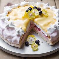 Meringue cake pudding with lemon curd sauce and berries as food, bakery and holiday baking recipe, photo