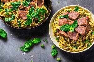 Noodles With Meat And Mint On Top photo