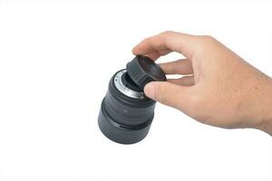 camera lens in male hand isolate white background photo