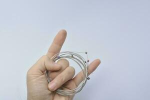 new guitar strings on guitar player , the finger of a guitarist white background photo