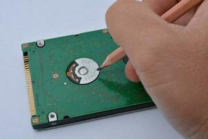 Save data on old hard drives, with a hand-drawn pencil. photo