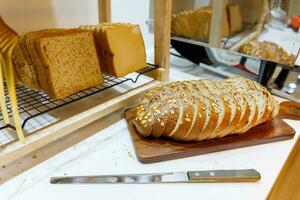 oat wholemeal bread, sliced on board photo