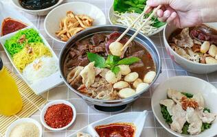 Thai boat noodles with Thai spices and ingredient on background. photo