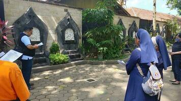 A group of nuns and lay people are praying the Stations of the Cross, remembering the crucifixion of the Lord Jesus photo