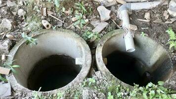 Photo of two infiltration wells lined up. Infiltration wells are used to reduce standing water which can damage the building structure.