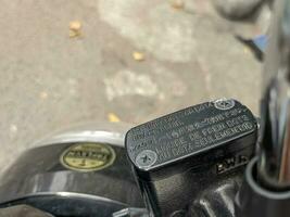 A close up of motorcycle brake master photo