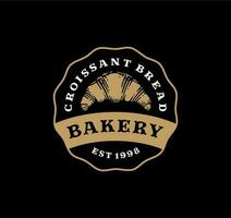 Logo badge of croissant bread in vintage design. bakery label design on black background vector