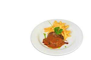 sirloin steak with pepper sauce serve with french fries photo