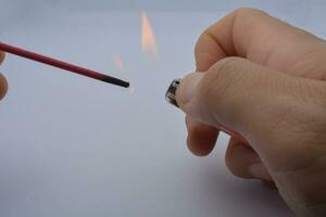 Soldering iron and solder on black background photo