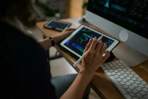 Futuristic women Engineer working with Holographic Augmented Reality and 3D Wind Turbine Model on tablet at home office ,Concept of technology and environment photo