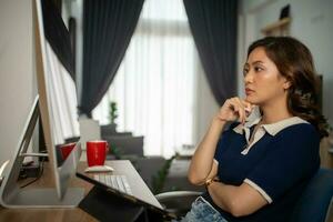 Futuristic women Engineer working with Holographic Augmented Reality and 3D Wind Turbine Model on tablet at home office ,Concept of technology and environment photo