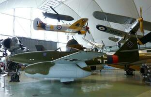 London  England UK  June 29, 2014 Royal Air Force RAF Museum. Real historic aircrafts from all over the world. In foreground a German Me 262. photo