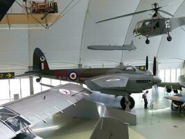 London  England UK  June 29, 2014 Royal Air Force RAF Museum. Real historic aircrafts from all over the world. In foreground a British Mosquito. photo