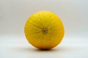 Canary yellow melon isolated on white background. photo
