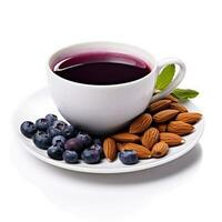 Blueberry almond tea in a blueberry and almond-colored cup isolated on white background photo