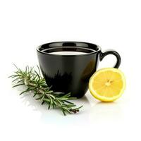 Rosemary lemon tea in a black cup isolated on white background photo