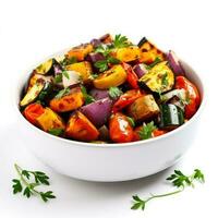 Roasted vegetable medley with herbs isolated on white background photo