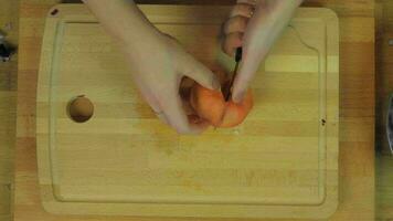 Woman Chopping Tomato at Wooden Kitchen Table video