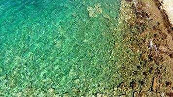 Clear and Shallow Sea Water of the Cove Surrounded by Stone and Rocky Coastline video
