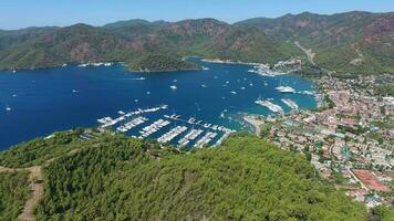 Small City Houses, Beautiful Marina and Touristic Boats in a Cove Surrounded by Forest by Sea video