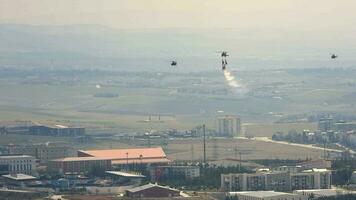 People Hanging From Helicopter Performing Stunt Flying video