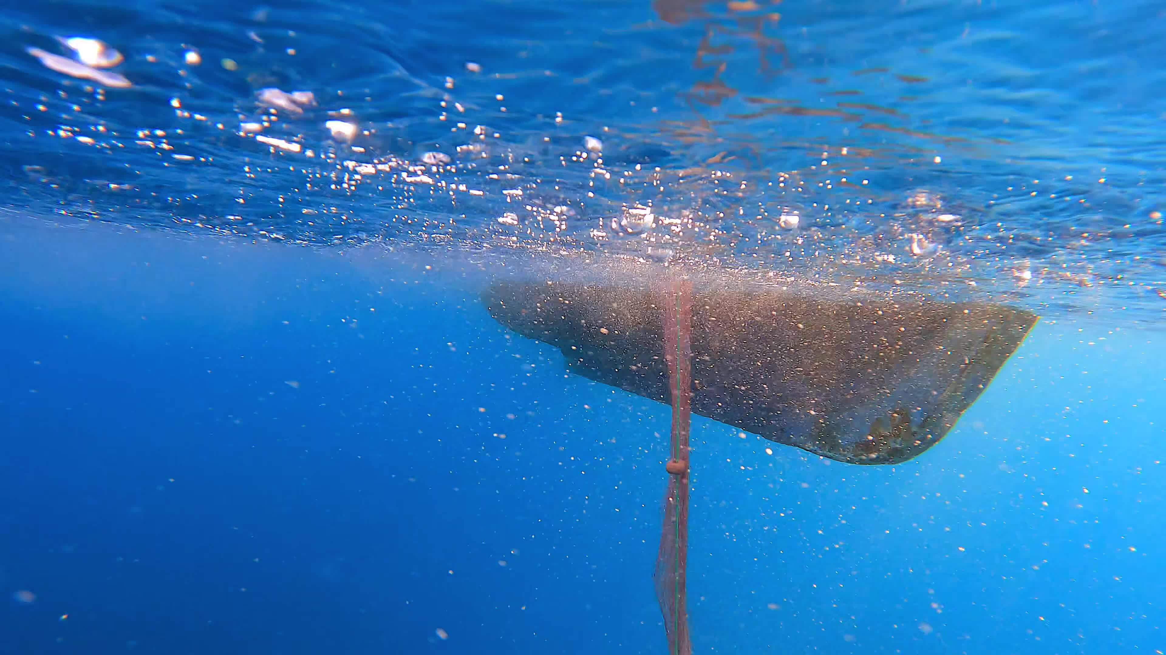 Fishing Net Hanging From Boat Under Sea in Underwater 26566101