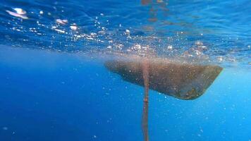 Fishing Net Hanging From Boat Under Sea in Underwater video