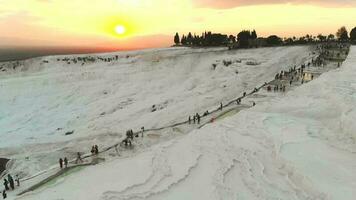 Visitors and Tourist People Walks Pamukkale's Calcium Carbonate Travertines at Sunset video