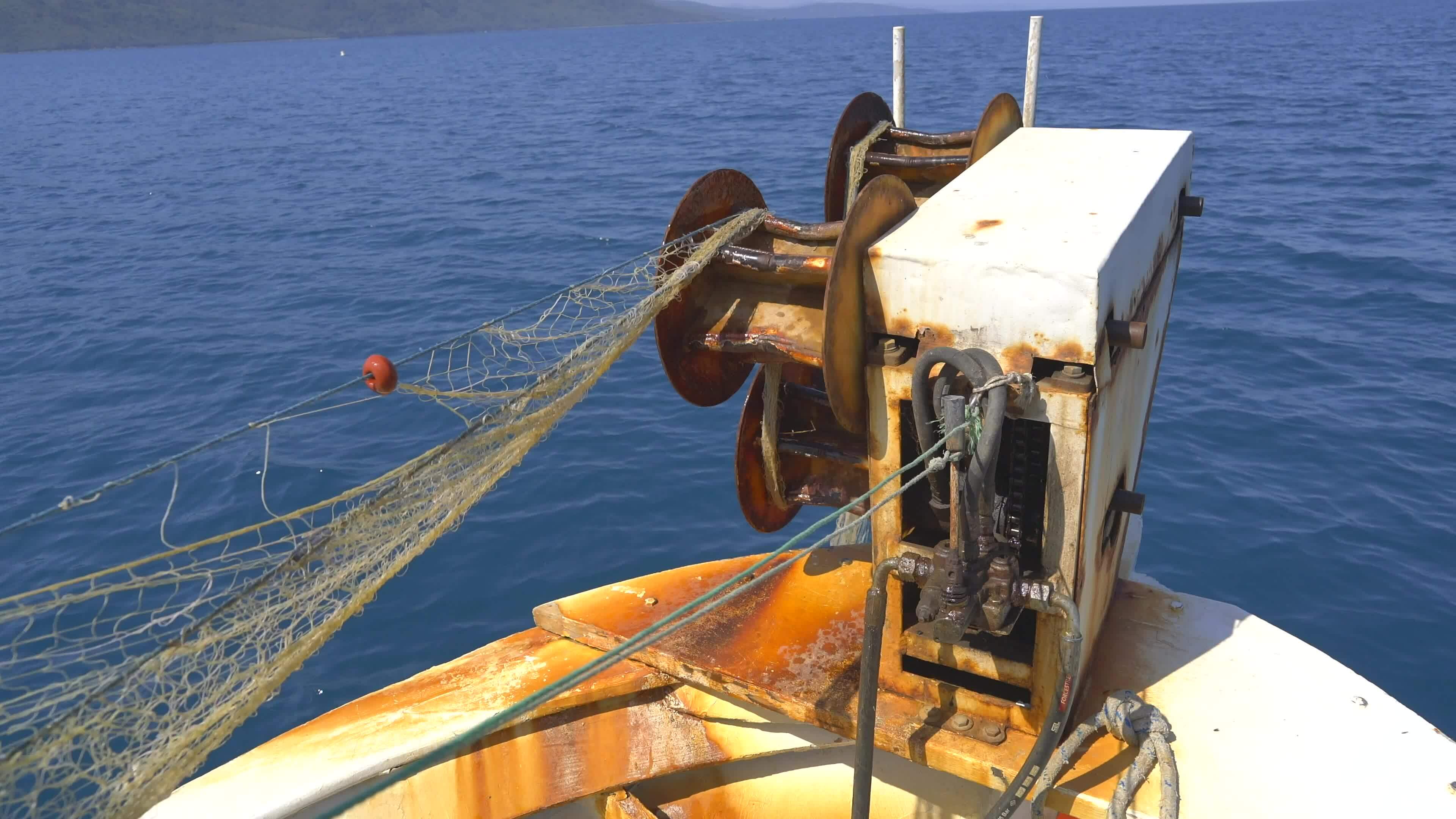 Net Reel on Small Fishing Boat Pulling Net 26569041 Stock Video at Vecteezy