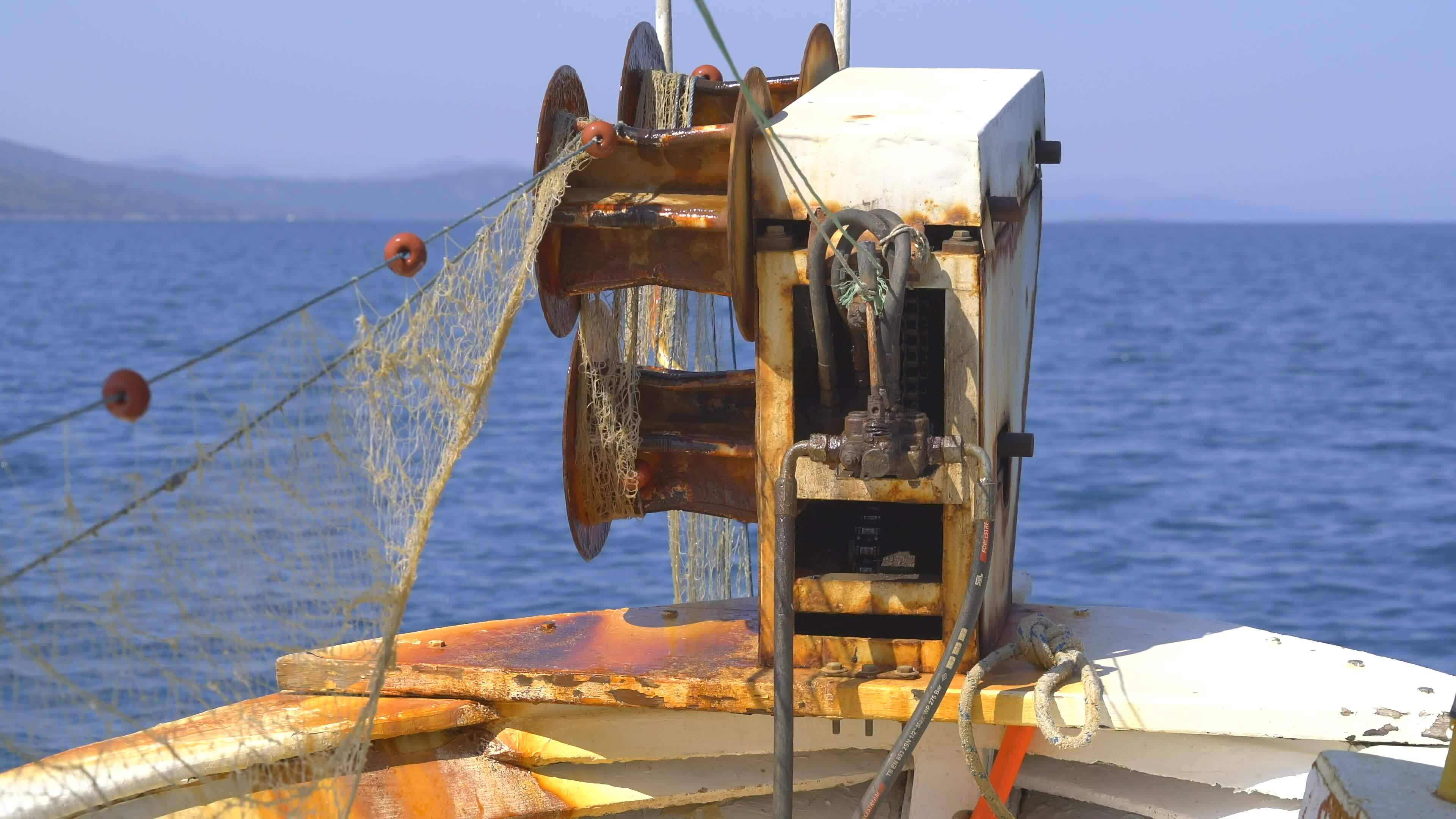 Net Reel on Small Fishing Boat Pulling Net 26569288 Stock Video at Vecteezy