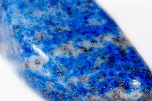 Macro mineral stone blue lapis lazuli afghanistan on white background photo