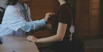 Mental health counselor. Young woman during therapy session talking with a psychologist in the office. photo