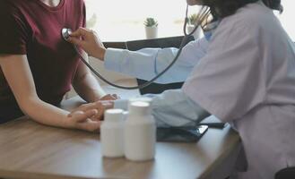 Mental health counselor. Young woman during therapy session talking with a psychologist in the office. photo