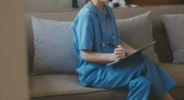 Mental health counselor. Young woman during therapy session talking with a psychologist in the office. photo