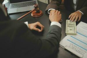 Business and lawyers discussing contract papers with brass scale on desk in office. Law, legal services, advice, justice and law concept picture with film grain effect photo