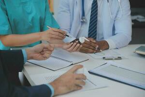 Cropped image of successful medical doctors discussing diagnosis during the conference photo