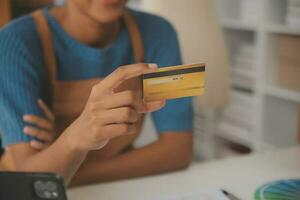 Retail, credit card payment service. Customer paying for order of cheese in grocery shop. photo