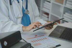 Professional lab. Amazing longhaired medical worker wearing uniform while using microscope during research photo