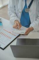 Professional lab. Amazing longhaired medical worker wearing uniform while using microscope during research photo